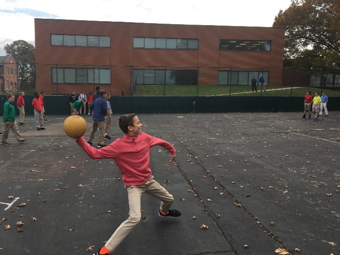 A member of Mr. Master’s mentor group winds up to throw the ball