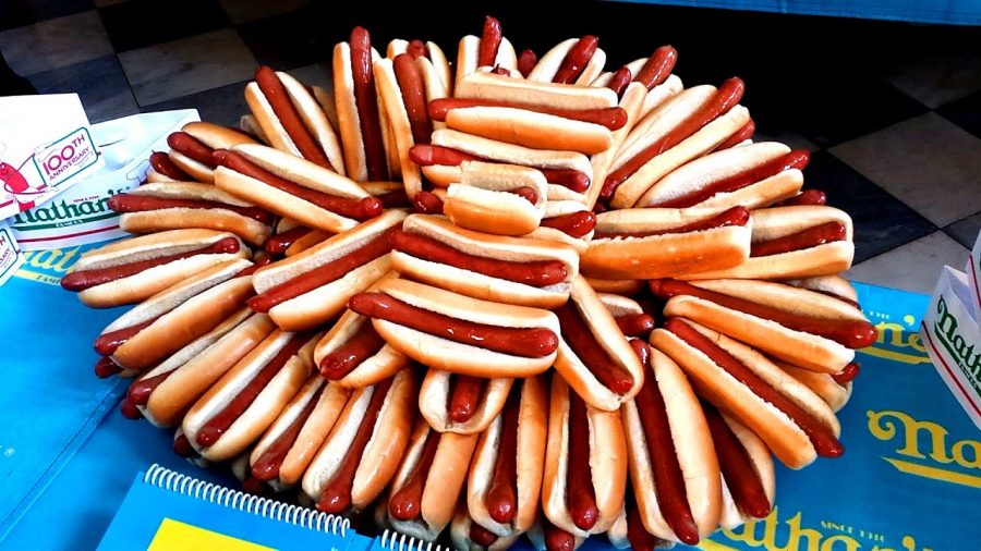 Mauclerc Gobbles up the Competition at Heritage Week Hot Dog Eating Contest